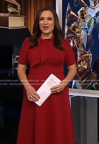 Nikki Battiste’s red tie neck midi dress on CBS Evening News