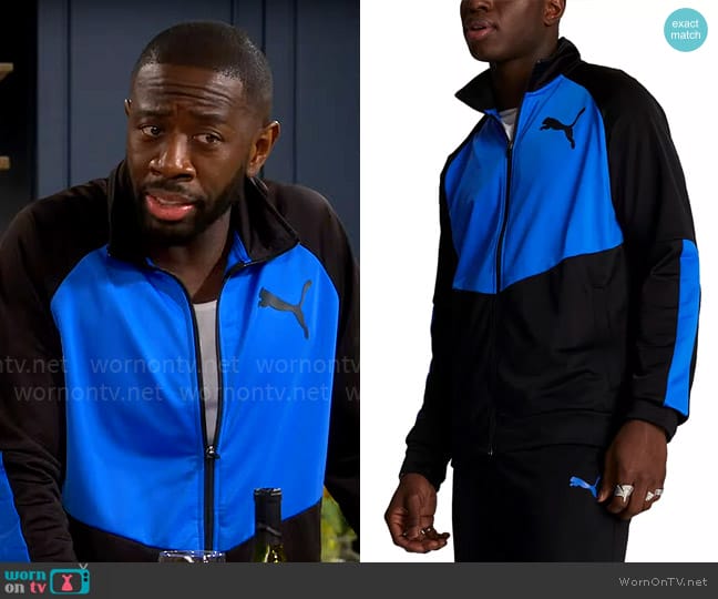 Puma Contrast Logo Tricot Jacket in Puma Black Racing Blue worn by Malcom (Sheaun McKinney) on The Neighborhood