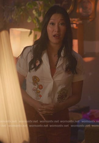 Sumi's white floral embroidered shirt on Good Trouble