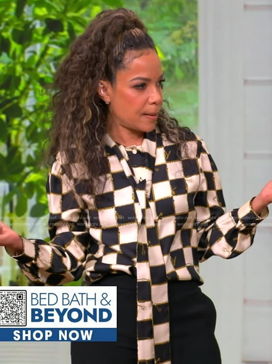 Sunny’s checkerboard print tie neck blouse on The View