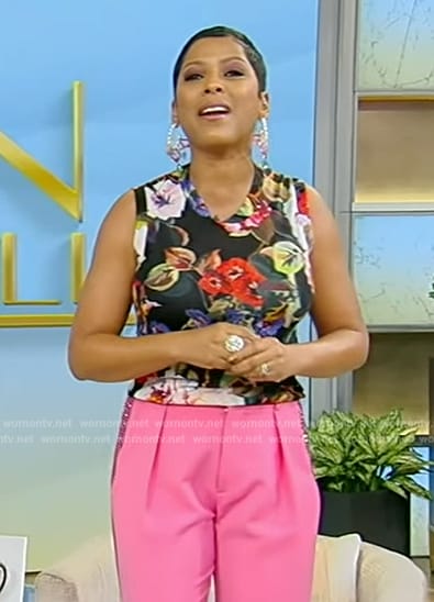 Tamron's black floral print tank and embellished pink pants on Tamron Hall Show