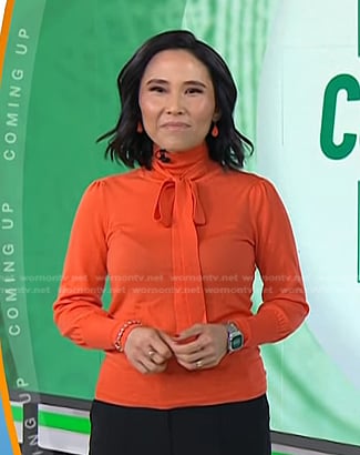 Vicky’s orange tie neck knit top on Today