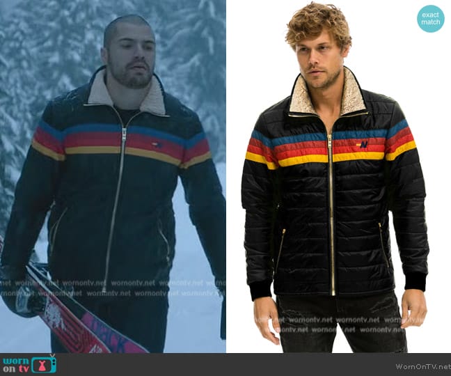 Jules’ black rainbow stripe puffer jacket on Death and Other Details