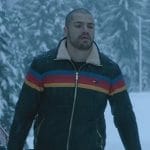 Jules’ black rainbow stripe puffer jacket on Death and Other Details