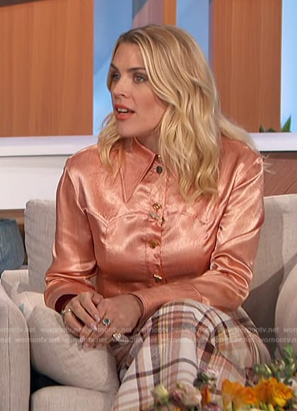 Busy Phillips' plaid skirt and pink satin blouse on The Talk