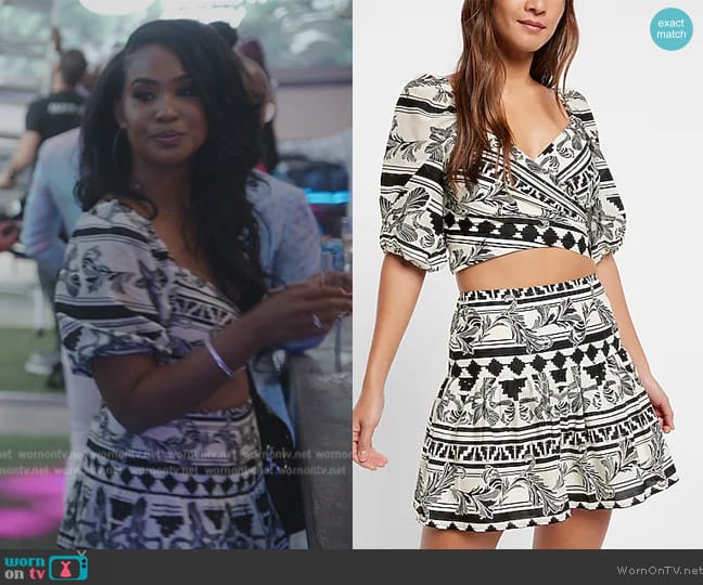 Express Printed Faux Wrap Puff Sleeve Cropped Top worn by Jacqueline Blake on The Real Housewives of Potomac