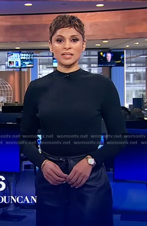 Jericka's black ribbed top and leather skirt on CBS Evening News