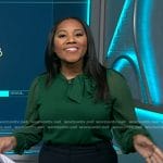 Kay Angrum’s green sheer sleeve tie neck top on NBC News Daily