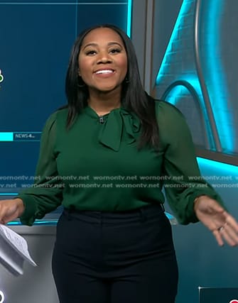 Kay Angrum's green sheer sleeve tie neck top on NBC News Daily