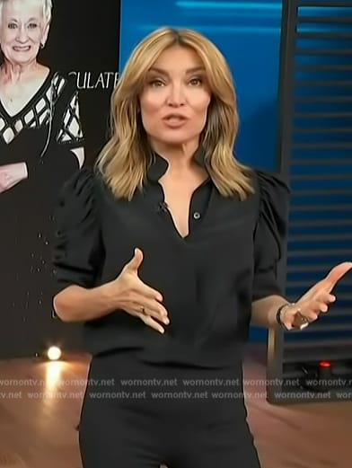 Kit’s black puff sleeve top on Access Hollywood