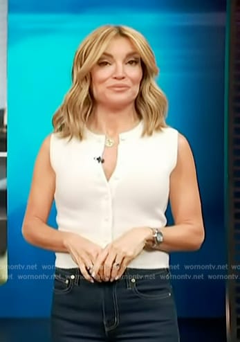 Kit’s white button sleeveless top on Access Hollywood