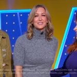 Lara’s grey sweater and snake print skirt on Good Morning America