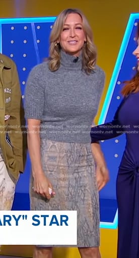 Lara’s grey sweater and snake print skirt on Good Morning America