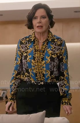 Margaret's blue and gold flourish print blouse on So Help Me Todd