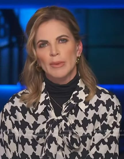 Natalie Morales’ houndstooth print tie neck blouse on Access Hollywood