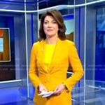 Norah’s yellow belted suit on CBS Evening News