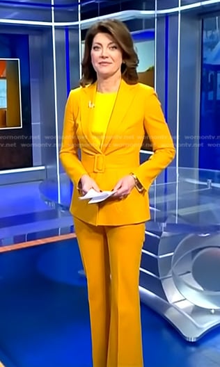 Norah’s yellow belted suit on CBS Evening News