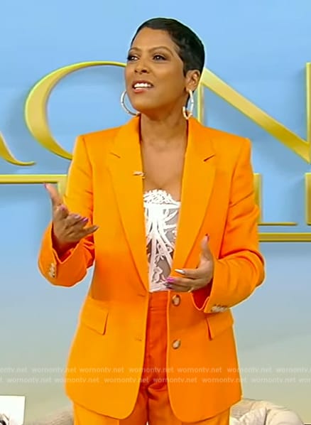 Tamron’s white lace bustier top and blazer on Tamron Hall Show