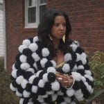 Wickie’s black and white pom-pom jacket on Girls5eva