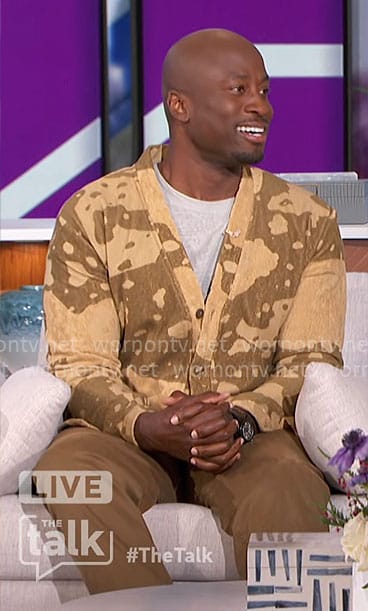 Akbar's khaki splatter print cardigan on The Talk