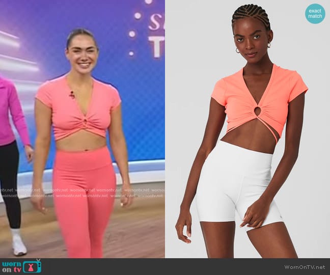 Alo Yoga Airbrush Criss Cross Short Sleeve in candy Orange worn by Meghan McFerran on Today