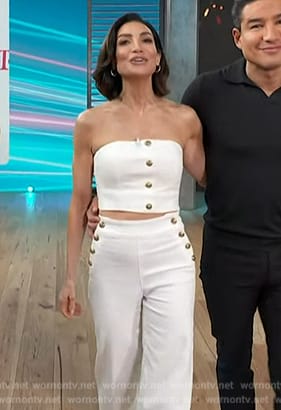 Courtney’s white button vest and pants on Access Hollywood