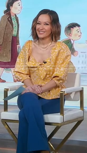 Eva's yellow floral peplum top and blue flare pants on Good Morning America