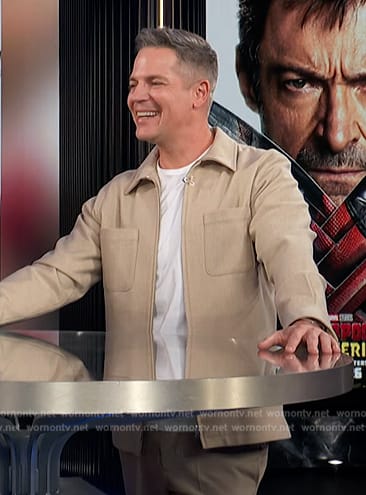 Jason’s beige jacket on E! News