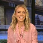 Kelly’s pink tie neck blouse on Live with Kelly and Mark