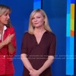 Kirsten Dunst’s burgundy polo top and pleated skirt on Good Morning America