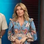 Kit’s blue floral print romper on Access Hollywood