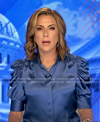 Kyra Phillips’s blue puff sleeve satin blouse on Good Morning America