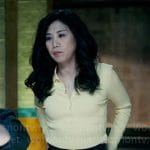 Mel’s yellow knit polo top on The Equalizer