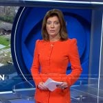 Norah’s orange belted jacket and cropped pants on CBS Evening News