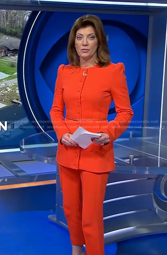 Norah's orange belted jacket and cropped pants on CBS Evening News