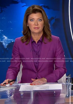 Norah's purple tie neck blouse and suit on CBS Evening News