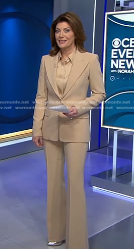 Norah’s satin blouse and beige suit on CBS Evening News