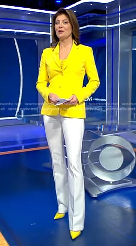 Norah’s yellow blazer and white flare pants on CBS Evening News