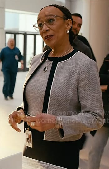 Sharon’s grey dress and jacket set with navy trims on Chicago Med