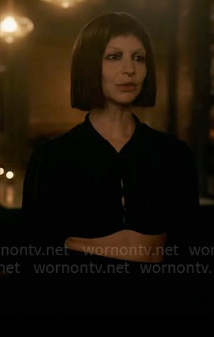 Sonia's black cropped top and green spiked heels on American Horror Story Delicate