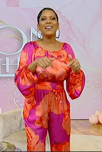 Tamron's pink and red floral print top and pants on Tamron Hall Show