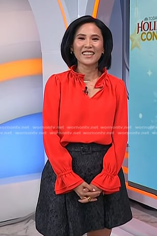 Vicky's red ruffle blouse and grey skirt on Today