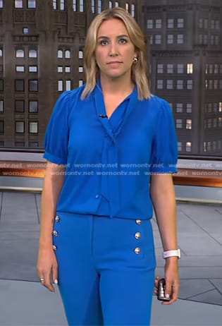 Alex Wilson's blue tie neck top and pants on CBS Evening News