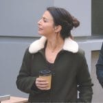 Amelia’s green shearling collar coat and brown crossbody bag on Greys Anatomy