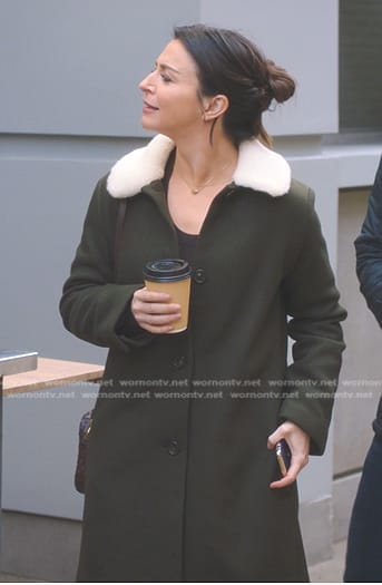 Amelia's green shearling collar coat and brown crossbody bag on Greys Anatomy