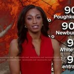 Brittany Bell’s red v-neck dress on Good Morning America