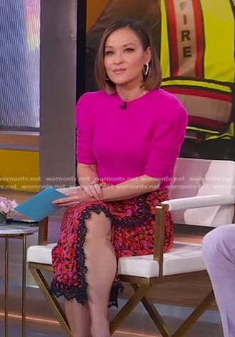 Eva’s pink short sleeve sweater and floral lace trim skirt on Good Morning America