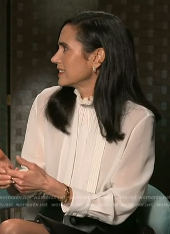 Jennifer Connelly’s white pleated blouse on Access Hollywood