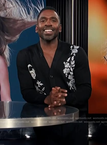 Justin’s black embroidered cardigan on E! News