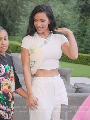 Kim's white crop tee and bag on The Kardashians